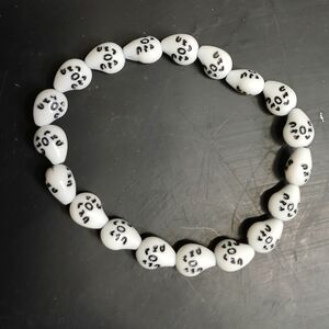 White and black plastic corn beads beaded stretch bracelet